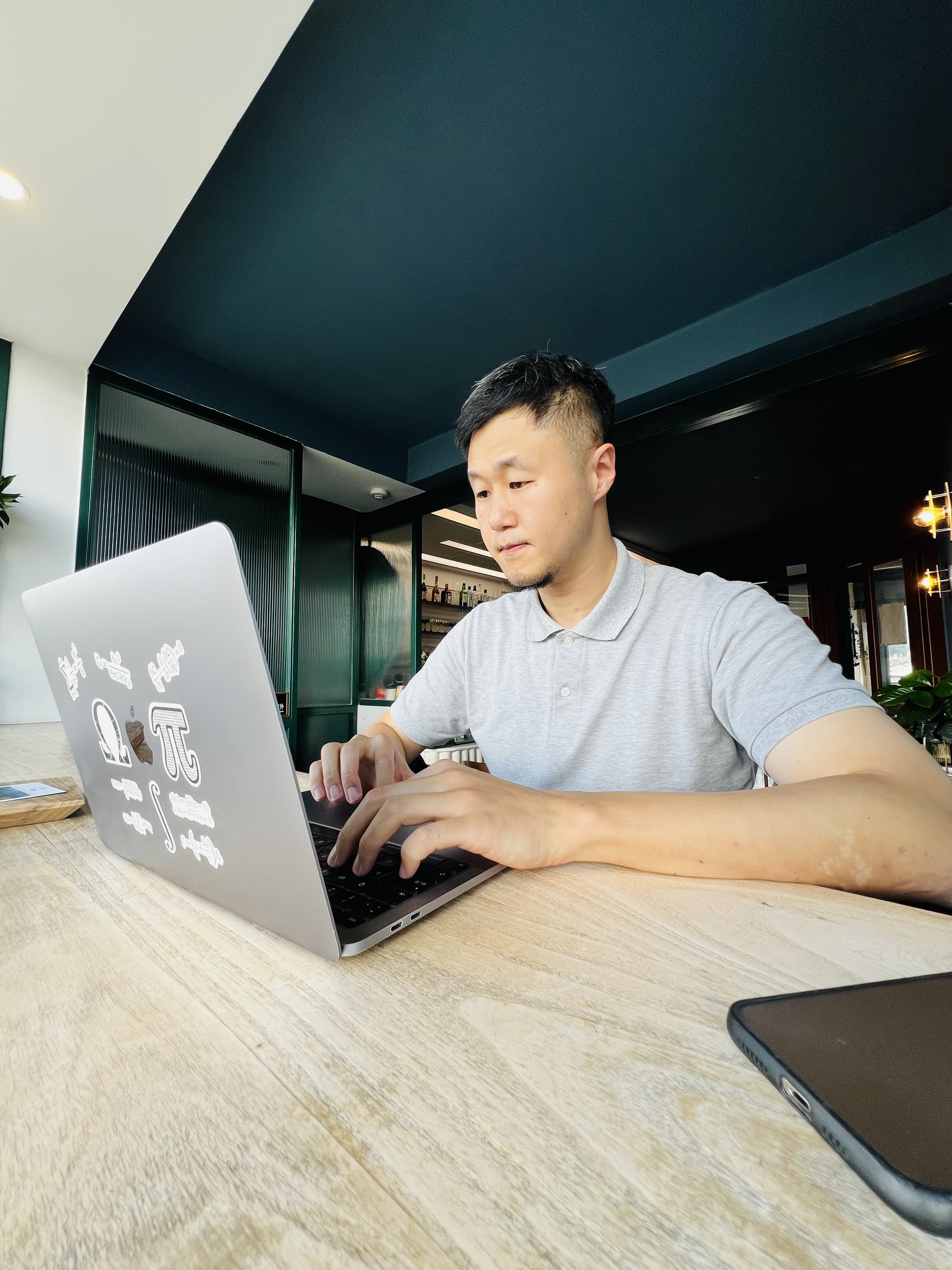 Adam working at a laptop